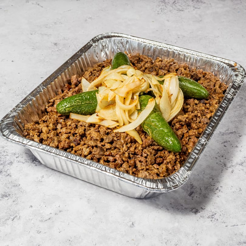 Jalisco Taqueria's Mexican food: a foil tray of ground meat topped with grilled onions and jalapeños.